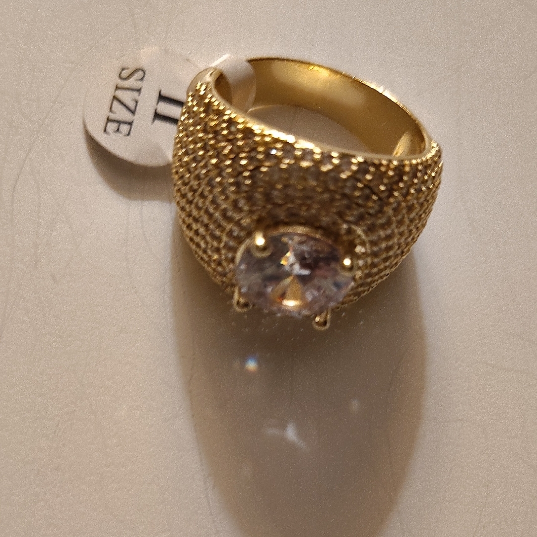 Gold And White Ring With Intricate Design And Clear Stone